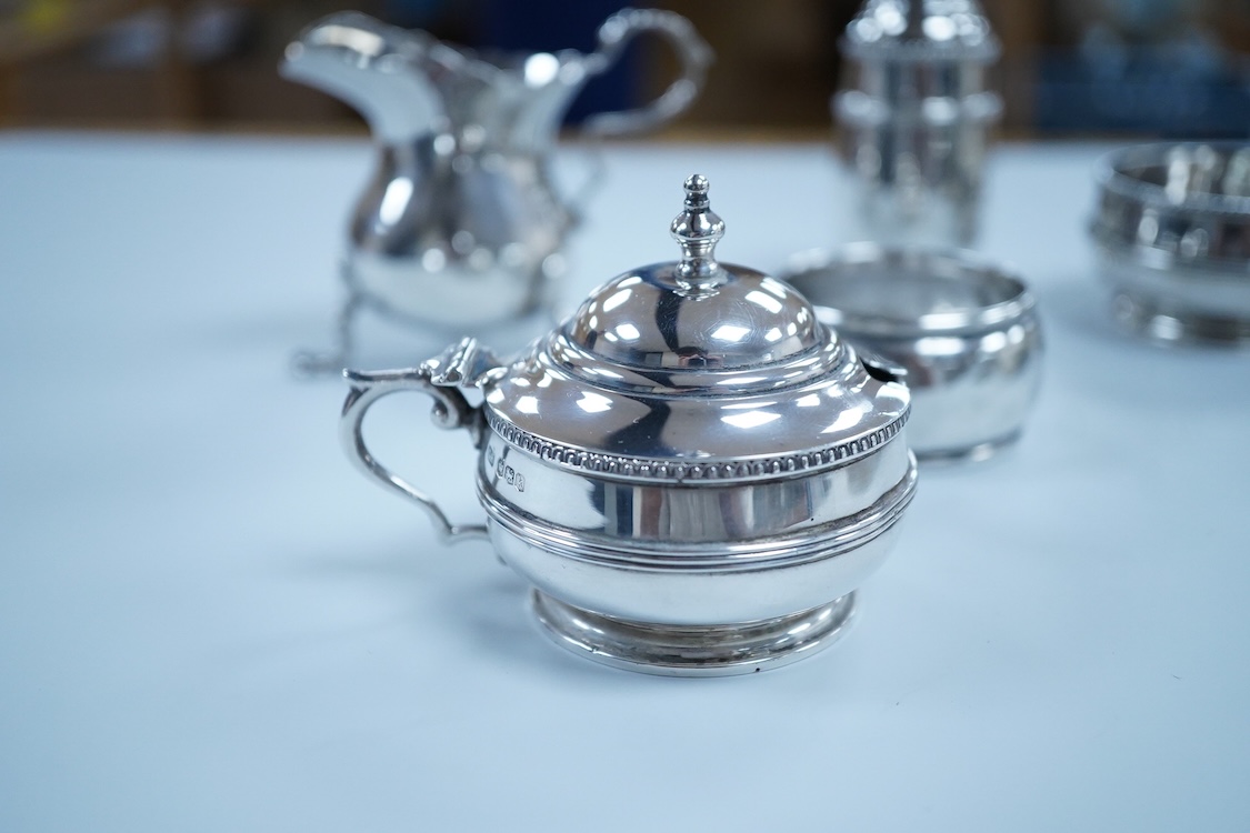 Small silver including a three piece cruet set, by George Howson, Sheffield, 1924/5/6, a napkin ring, a cream jug and a set of six 830s coffee spoons.